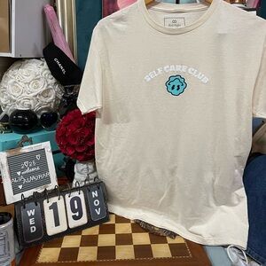 Red Eight "Self Care Club" graphic t-shirt.
